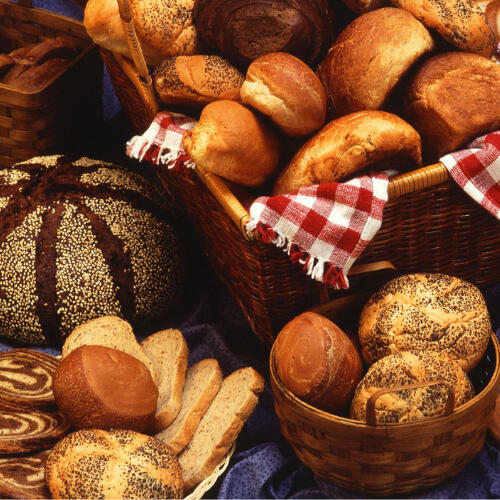 several baskets of assorted breads